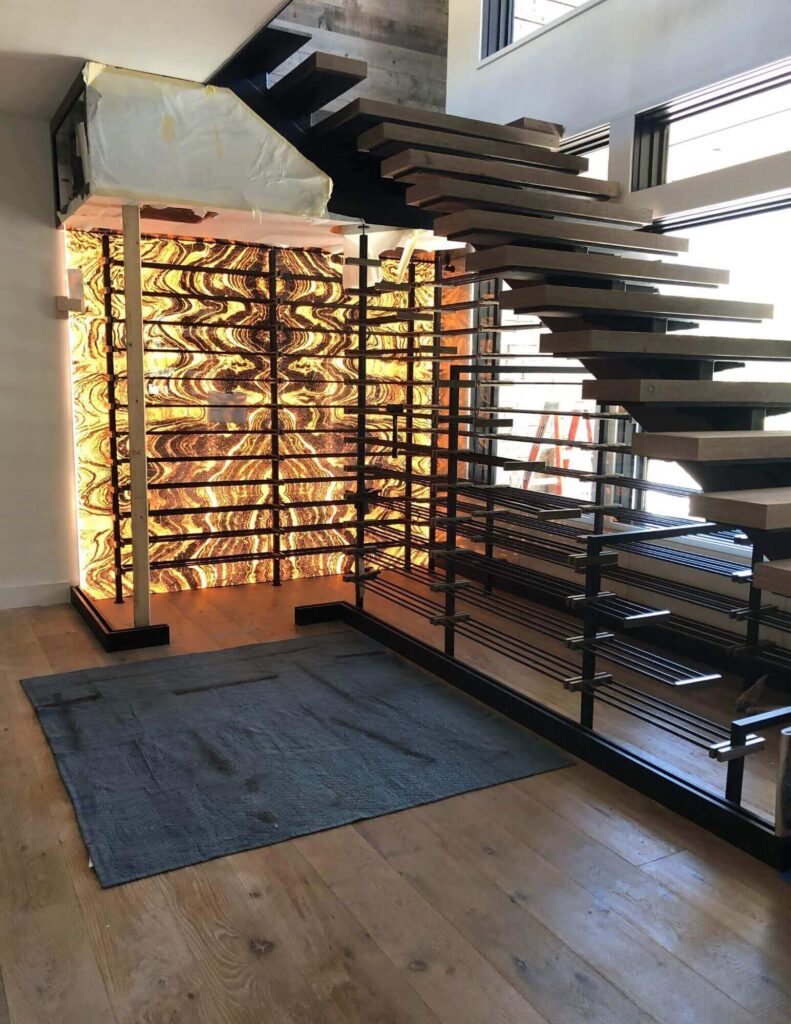 under stairs custom wine cellar installation process - Genuwine Cellars